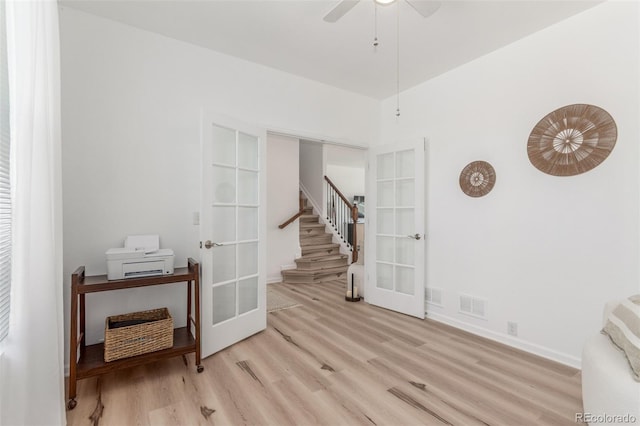 6400 S Ider St, Aurora, CO 80016 - empty room featuring french doors, wood finished floors, stairway, and ceiling fan