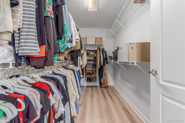6400 S Ider St, Aurora, CO 80016 - walk in closet featuring wood finished floors