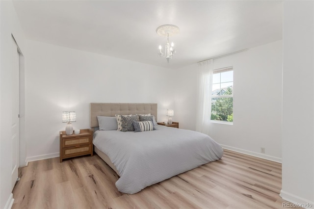 6400 S Ider St, Aurora, CO 80016 - bedroom with a chandelier and wood finished floors