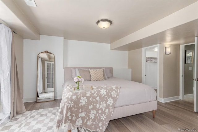 6400 S Ider St, Aurora, CO 80016 - bedroom featuring wood finished floors and baseboards
