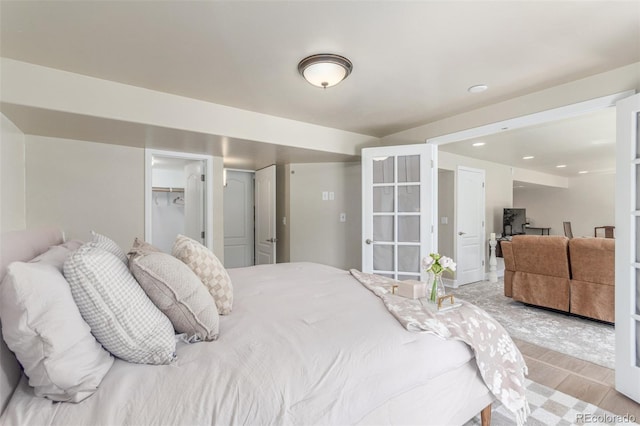 6400 S Ider St, Aurora, CO 80016 - bedroom with an office area, light wood-style floors, and recessed lighting