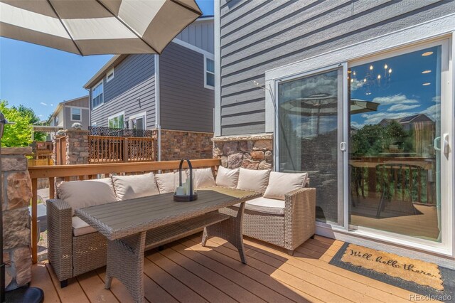 6400 S Ider St, Aurora, CO 80016 - wooden terrace with outdoor lounge area