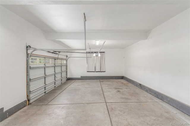 6400 S Ider St, Aurora, CO 80016 - garage featuring baseboards and a garage door opener