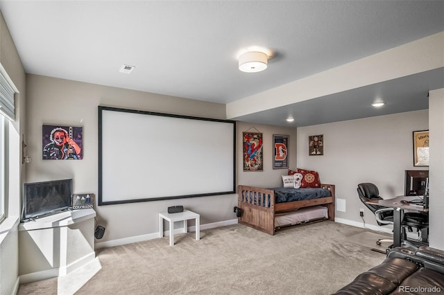 cinema room featuring carpet floors and baseboards