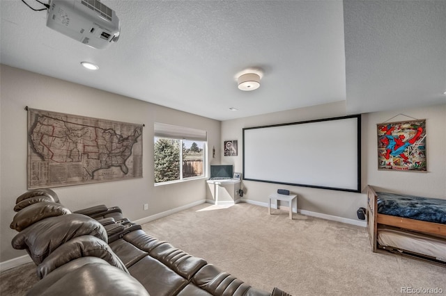cinema featuring carpet flooring, a textured ceiling, and baseboards