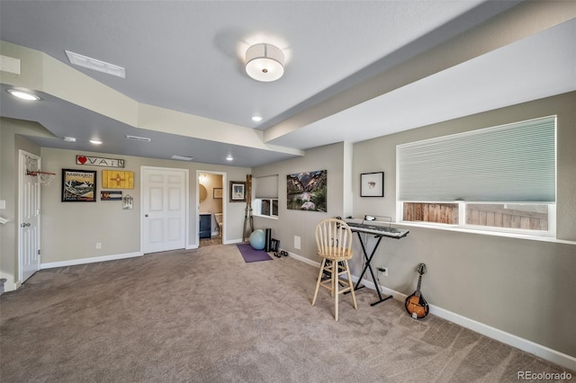 carpeted home office featuring baseboards and visible vents