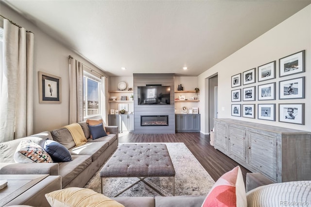 living room featuring recessed lighting, baseboards, a fireplace, and dark wood-style flooring