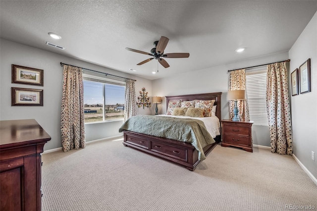 carpeted bedroom with baseboards, ceiling fan, recessed lighting, and visible vents