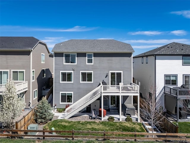 17382 Bluetrail Ave, Parker, CO 80134 - back of house with stairs, a patio area, a fenced backyard, and a deck