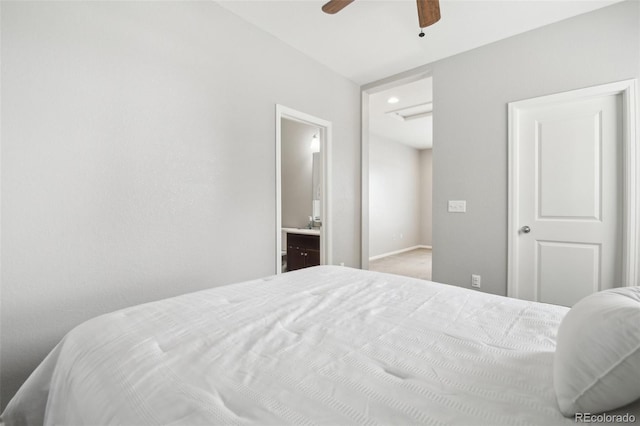 bedroom with ensuite bathroom and ceiling fan