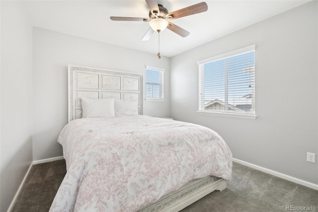 bedroom featuring ceiling fan and dark colored carpet