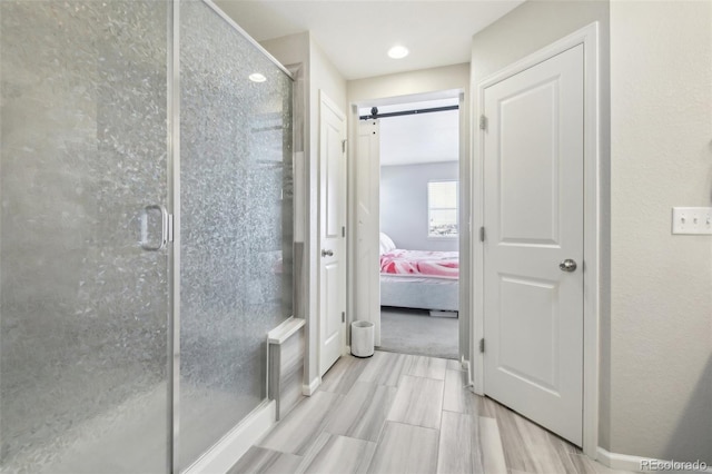 bathroom with a shower with shower door