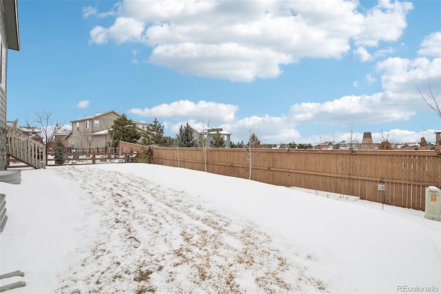 view of yard covered in snow