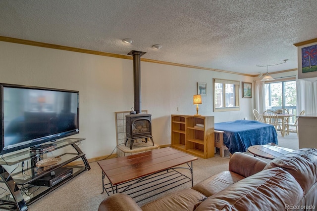 2710 Ryan Gulch Rd Unit 2714, Silverthorne, CO 80498 - carpeted living room with crown molding, a wood stove, and a textured ceiling