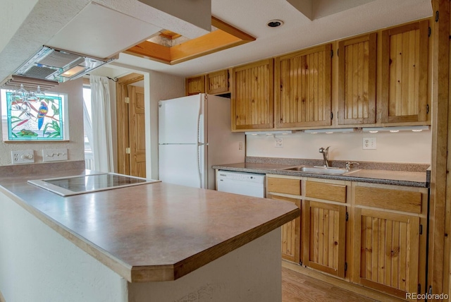 2710 Ryan Gulch Rd Unit 2714, Silverthorne, CO 80498 - kitchen featuring white appliances, a peninsula, light wood-type flooring, a chandelier, and brown cabinets