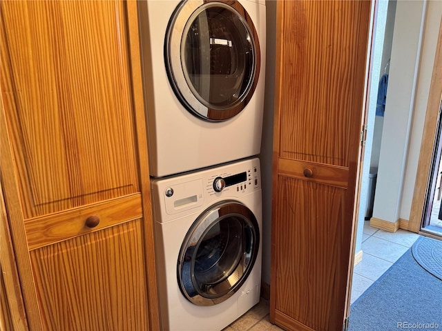 2710 Ryan Gulch Rd Unit 2714, Silverthorne, CO 80498 - laundry area with stacked washing machine and dryer and light tile patterned floors