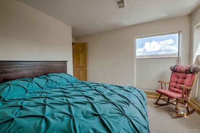 2710 Ryan Gulch Rd Unit 2714, Silverthorne, CO 80498 - carpeted bedroom featuring a textured ceiling
