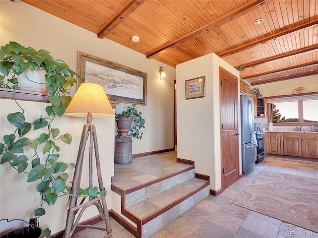 13012 S Wamblee Valley Rd, Conifer, CO 80433 - stairs featuring wooden ceiling with exposed beams and baseboards
