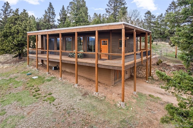 13012 S Wamblee Valley Rd, Conifer, CO 80433 - back of property featuring a wooden deck