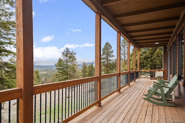 13012 S Wamblee Valley Rd, Conifer, CO 80433 - wooden terrace with a mountain view