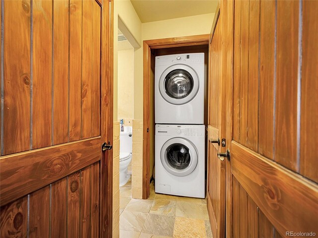 13012 S Wamblee Valley Rd, Conifer, CO 80433 - washroom with stacked washer and clothes dryer