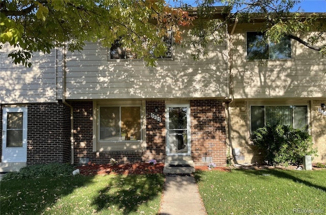 view of property with a front lawn