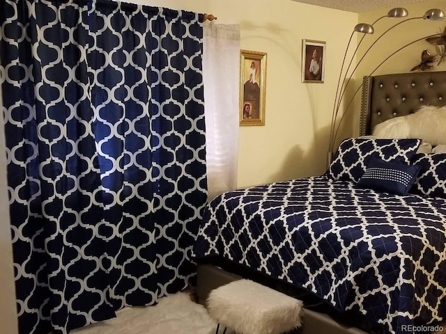 bedroom featuring a textured ceiling