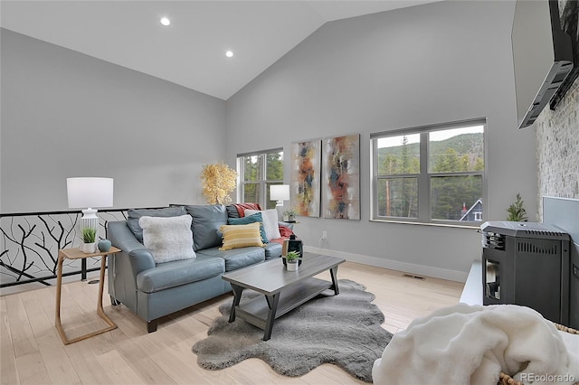 79 Beaver Rd, Idaho Springs, CO 80452 - living area featuring high vaulted ceiling, light wood finished floors, and recessed lighting