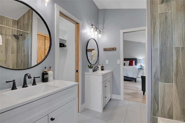 79 Beaver Rd, Idaho Springs, CO 80452 - bathroom with two vanities, ensuite bathroom, tile patterned flooring, and tiled shower
