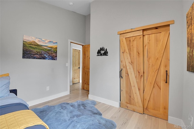 79 Beaver Rd, Idaho Springs, CO 80452 - living area featuring wood finished floors, baseboards, and a high ceiling