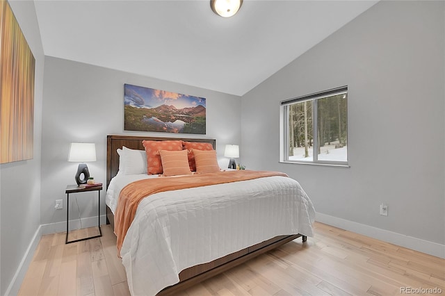 79 Beaver Rd, Idaho Springs, CO 80452 - bedroom with vaulted ceiling, light wood finished floors, and baseboards