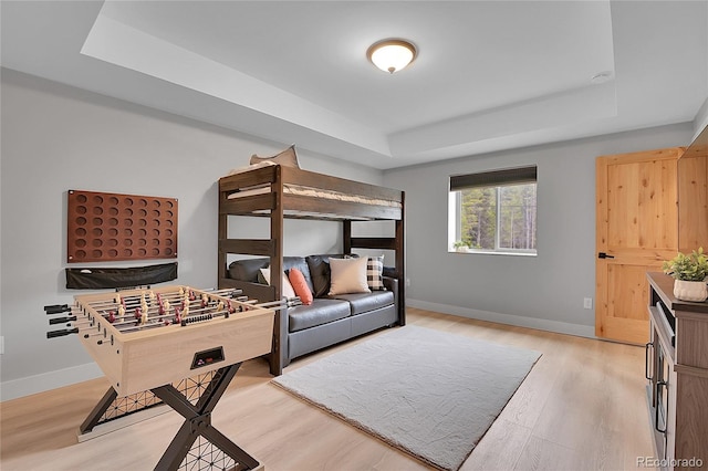 79 Beaver Rd, Idaho Springs, CO 80452 - bedroom featuring a raised ceiling, baseboards, and light wood finished floors