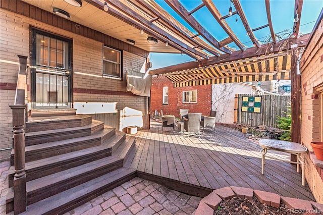 deck with outdoor dining area, a pergola, and entry steps