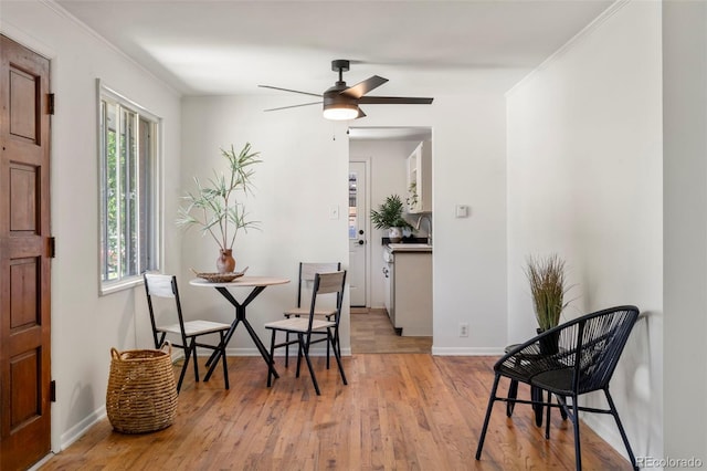 9300 W 53rd Ave, Arvada, CO 80002 - dining area featuring wood finished floors, ceiling fan, and ornamental molding