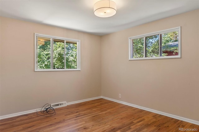 9300 W 53rd Ave, Arvada, CO 80002 - spare room featuring baseboards and wood finished floors
