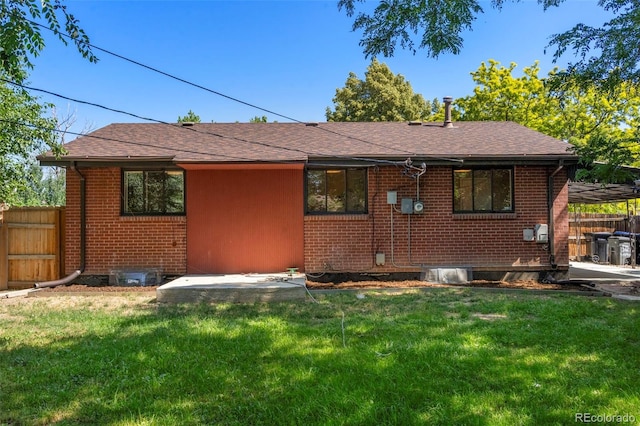 9300 W 53rd Ave, Arvada, CO 80002 - back of house with brick siding and a shingled roof