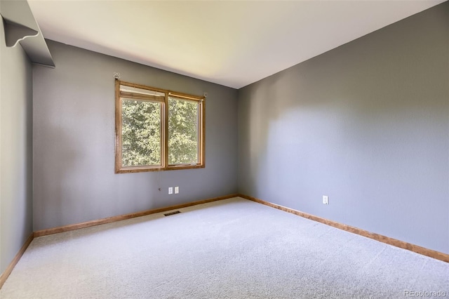 7043 S Owens Way, Littleton, CO 80127 - empty room featuring carpet floors and baseboards