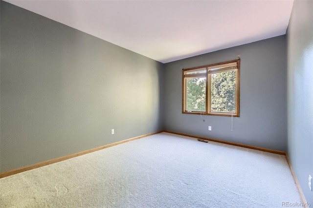 7043 S Owens Way, Littleton, CO 80127 - spare room featuring carpet and baseboards