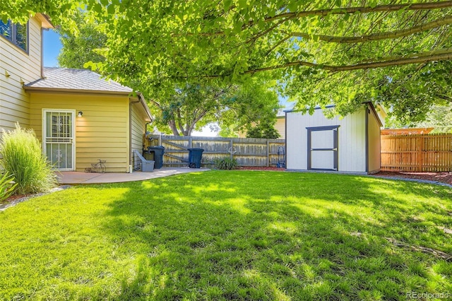 7043 S Owens Way, Littleton, CO 80127 - fenced backyard with a storage shed, a gate, and a patio area