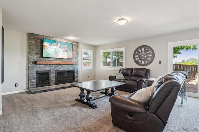 7311 Rattlesnake Dr, Lone Tree, CO 80124 - carpeted living room with a stone fireplace and baseboards
