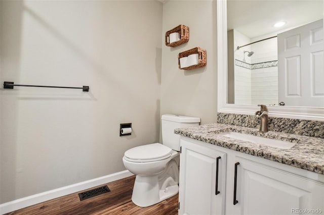7311 Rattlesnake Dr, Lone Tree, CO 80124 - bathroom featuring vanity, wood finished floors, and a shower