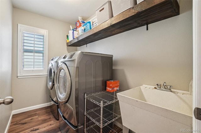 7311 Rattlesnake Dr, Lone Tree, CO 80124 - laundry area with washing machine and clothes dryer and wood finished floors