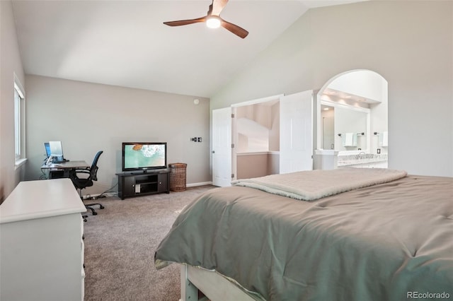 7311 Rattlesnake Dr, Lone Tree, CO 80124 - carpeted bedroom featuring high vaulted ceiling, a desk, ensuite bathroom, arched walkways, and ceiling fan
