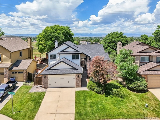 7311 Rattlesnake Dr, Lone Tree, CO 80124 - view of front of property featuring brick siding, concrete driveway, a residential view, roof with shingles, and a chimney