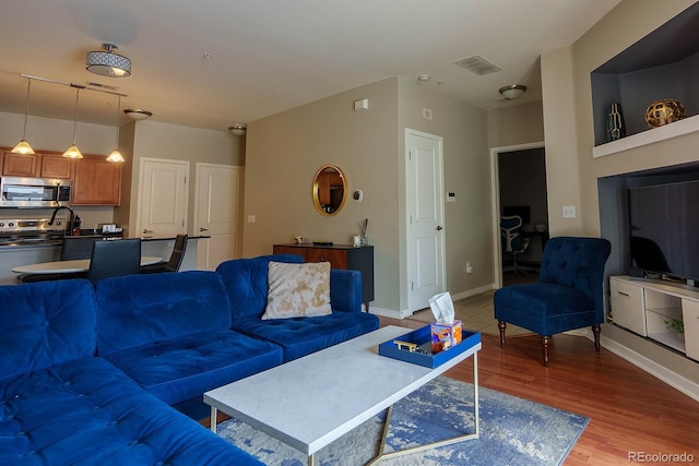 living room with hardwood / wood-style floors