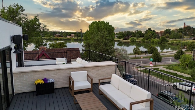 1645 N Osceola St, Denver, CO 80204 - deck at dusk with a water view and outdoor lounge area
