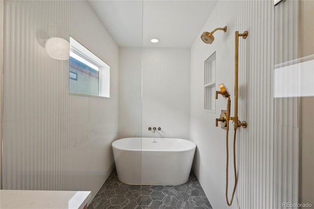 1645 N Osceola St, Denver, CO 80204 - bathroom with a soaking tub and tile patterned flooring