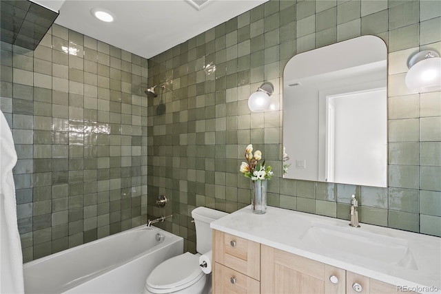1645 N Osceola St, Denver, CO 80204 - full bath with tile walls, bathing tub / shower combination, vanity, and tasteful backsplash