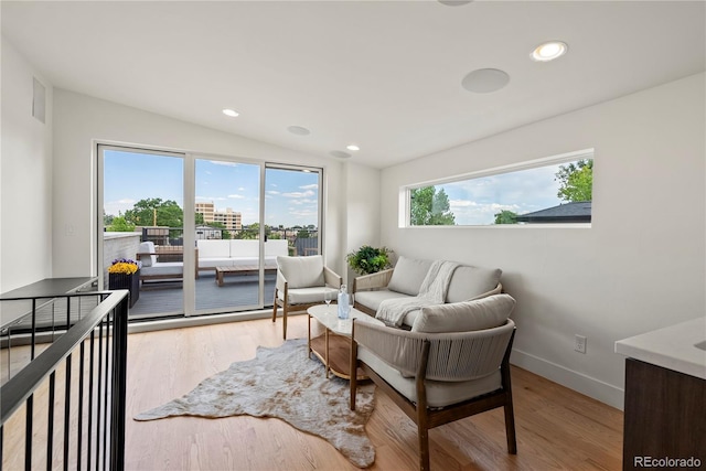 1645 N Osceola St, Denver, CO 80204 - living area with lofted ceiling, wood finished floors, and recessed lighting