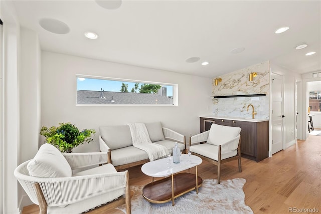 1645 N Osceola St, Denver, CO 80204 - living area featuring light wood-style flooring and recessed lighting